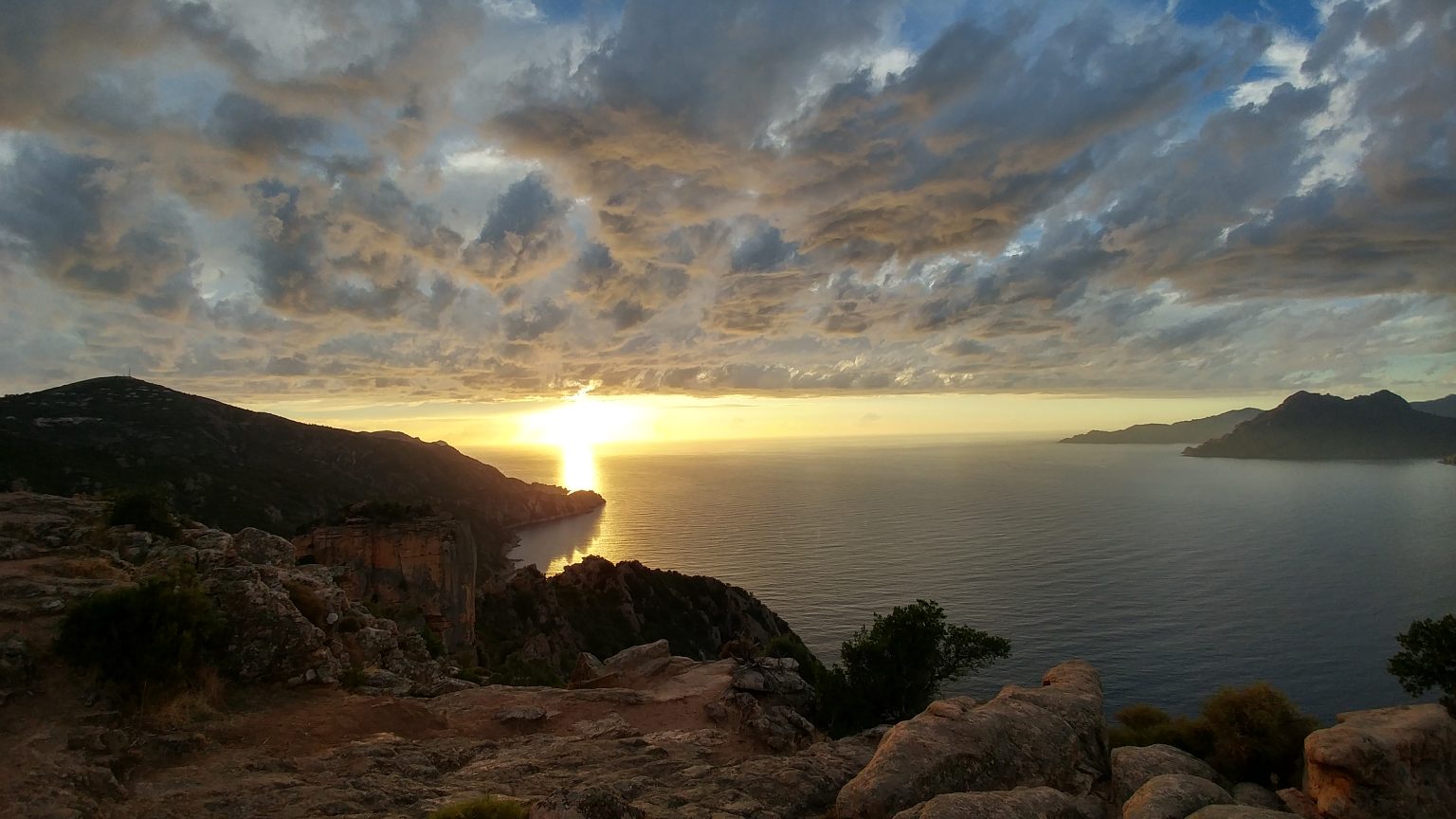 Dramatic sunset over ocean cliffs
